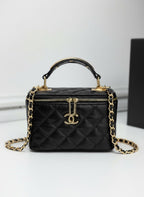 Chanel black quilted synthetic leather vanity crossbody bag with gold chain strap and CC logo.