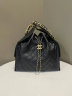 Divabags black grained calfskin Chanel 25 drawstring bag with gold chain strap and CC logo detail.
