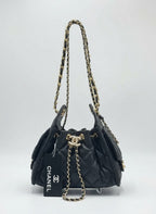 Divabags black grained calfskin Chanel 25 bucket bag with gold hardware and chain strap.