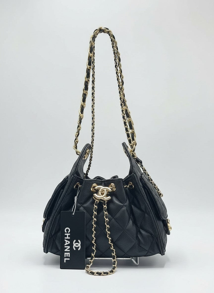 Divabags black grained calfskin Chanel 25 bucket bag with gold hardware and chain strap.